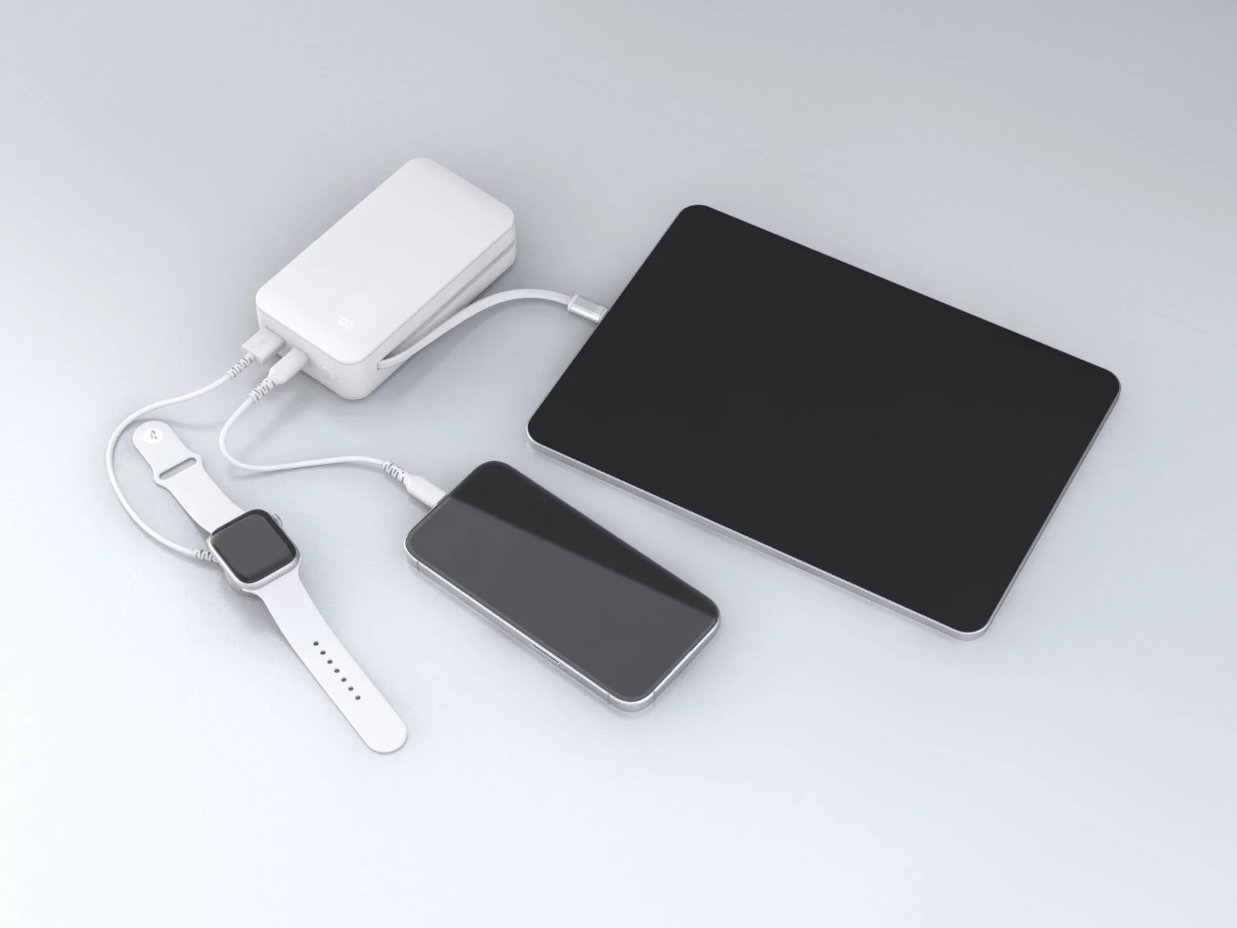 モバイルバッテリーで3台のデバイスを同時充電する様子