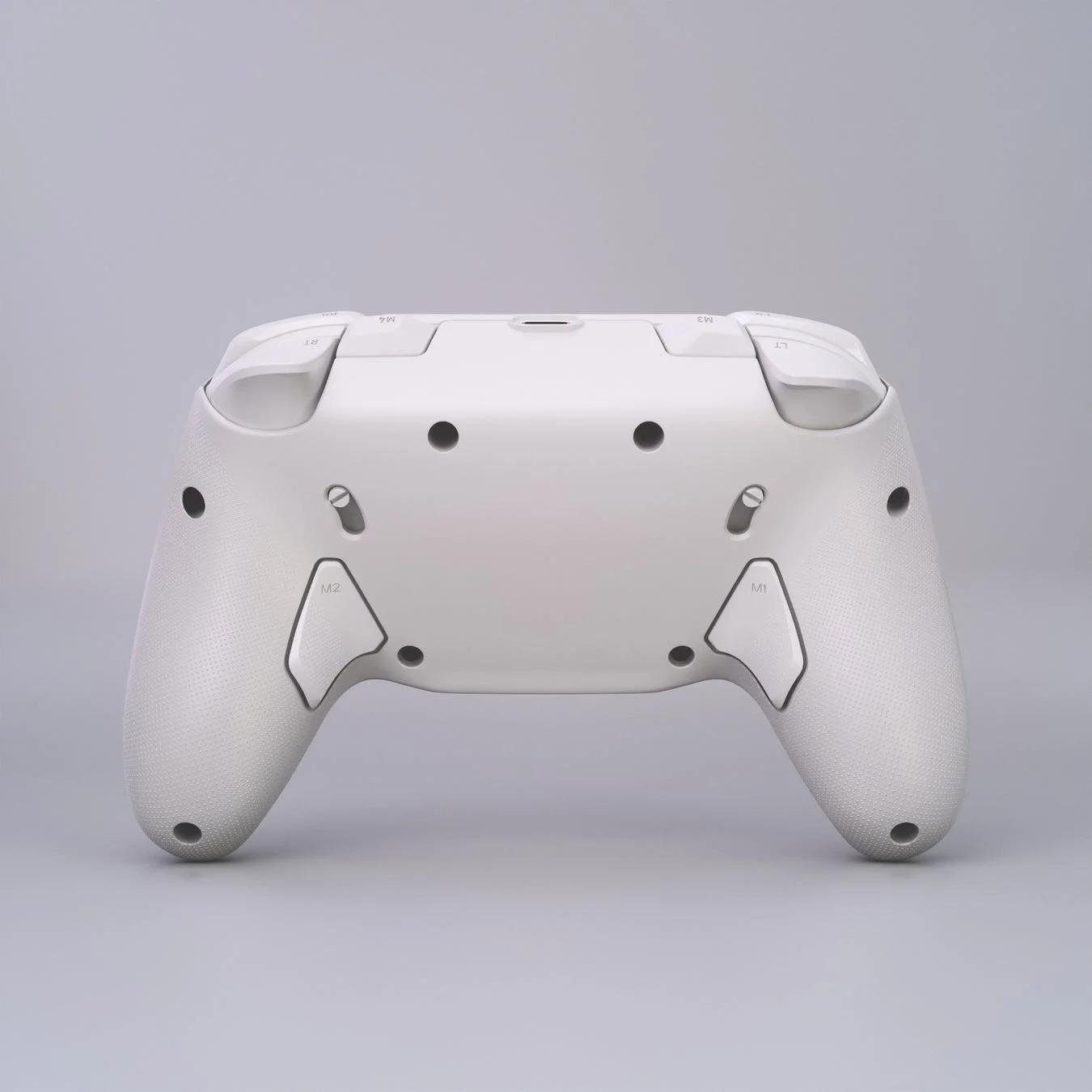 白いゲームコントローラーの背面を写した画像